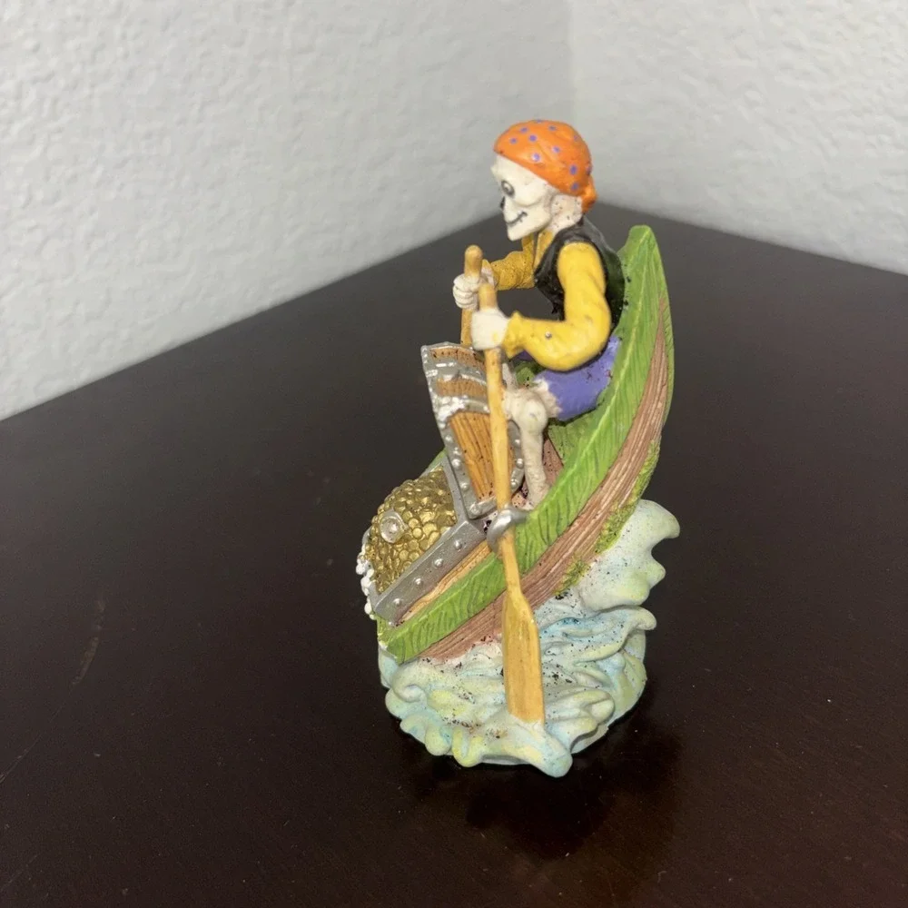 Aquarium decoration, skeleton pirate on row boat with treasure